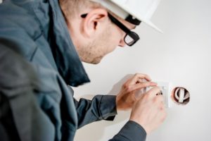 Electrician working with an outlet